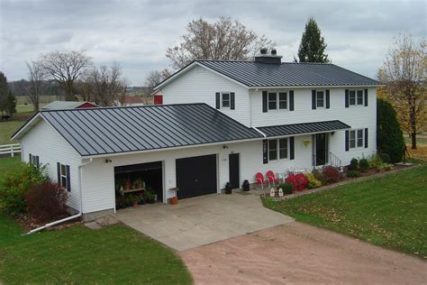 charcoal gray metal roof with white house|black metal roof colors.